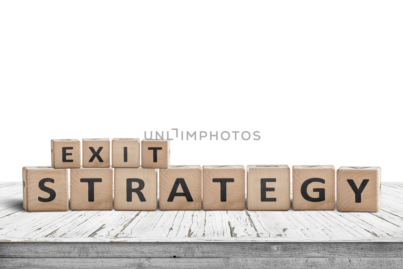 Exit strategy sign on a wooden desk isolated on white