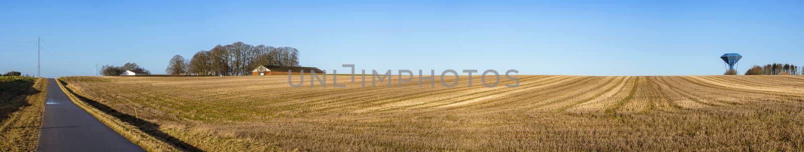 Rural panorama landscape with a dry field by Sportactive