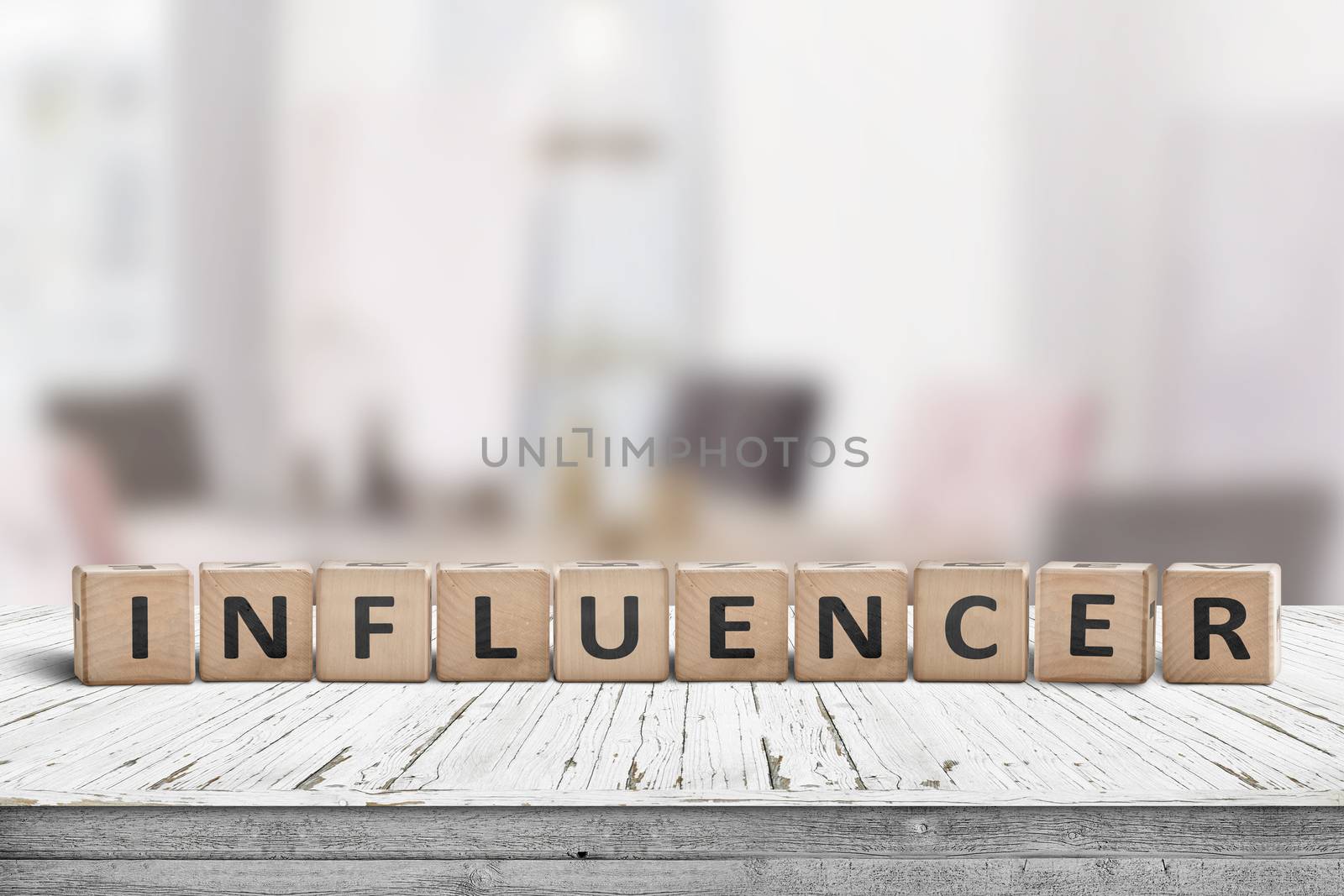 Influencer sign on a wooden table in a bright room of a blogger