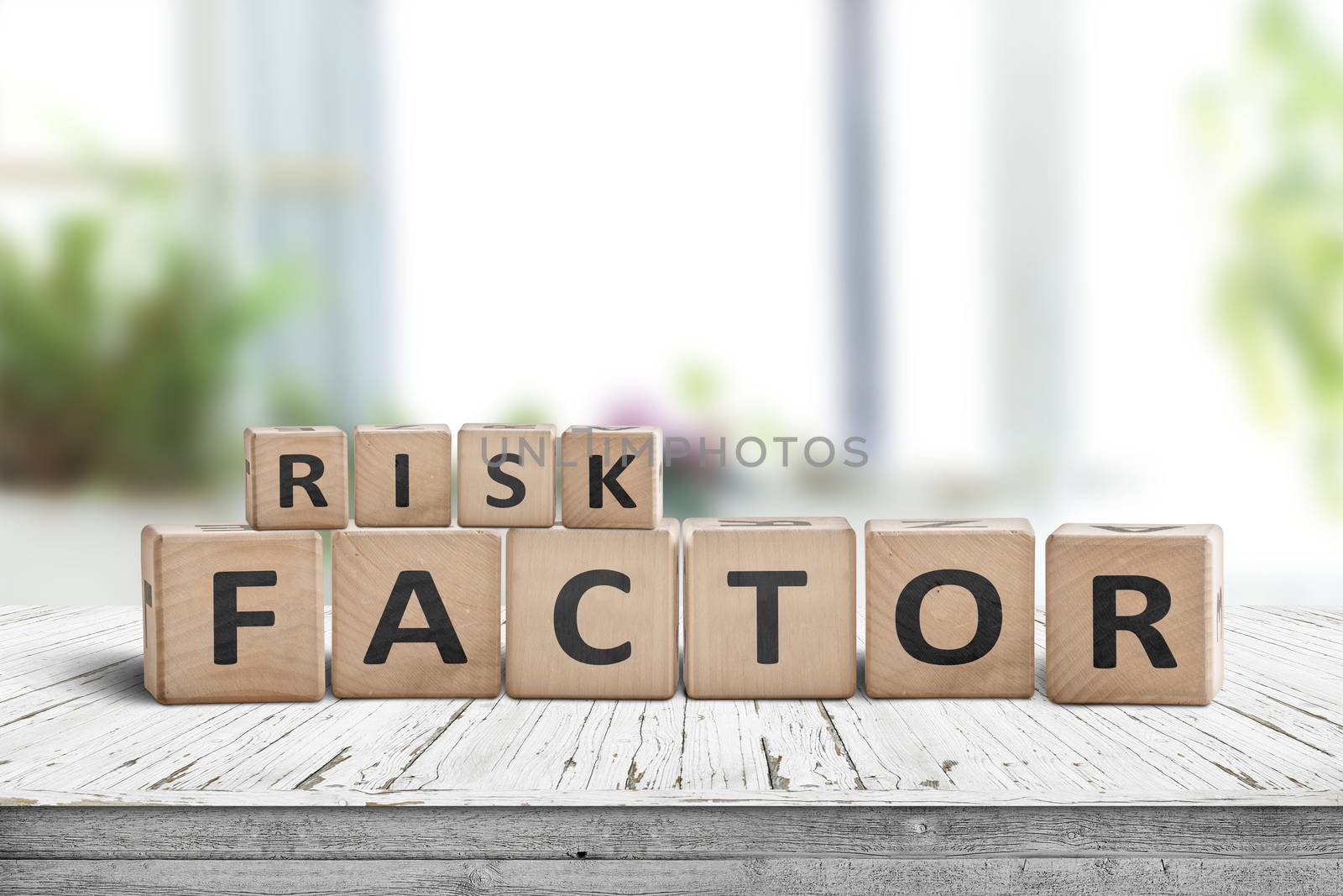 Risk factor sign on a wooden table in a bright living room in fresh daylight