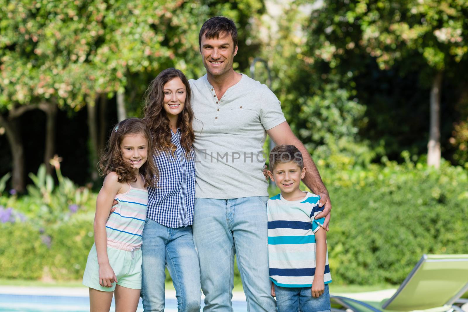 Portrait of happy family enjoying in the park