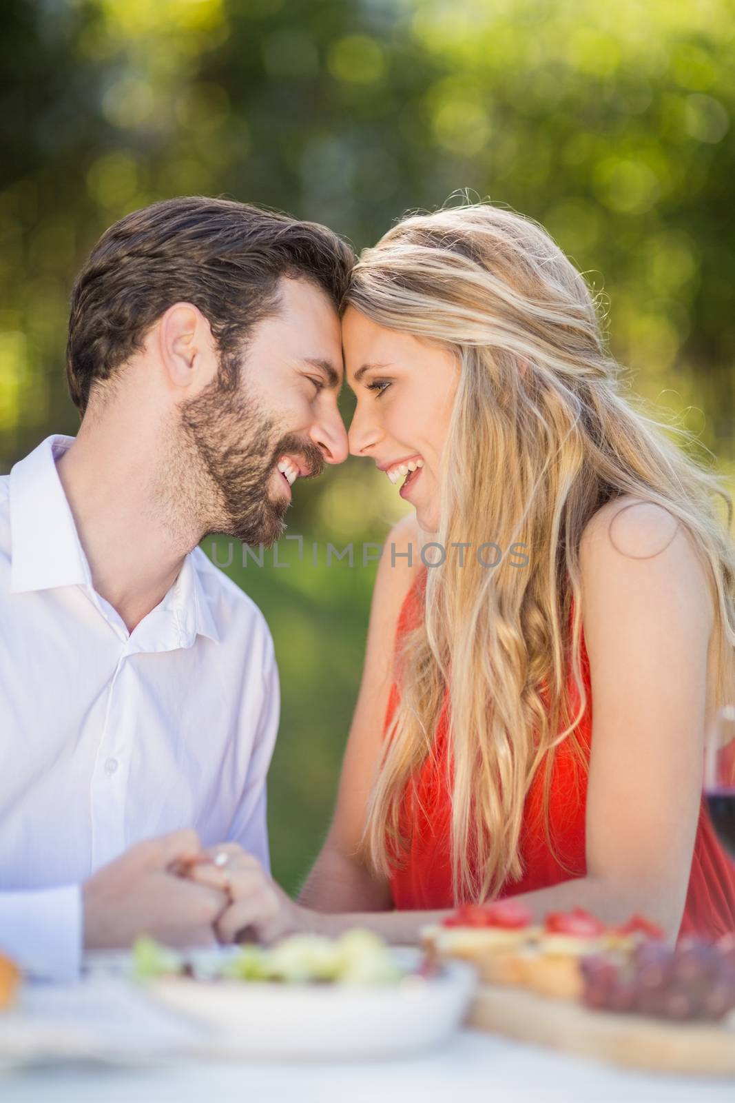 Happy couple embracing each other in the restaurant