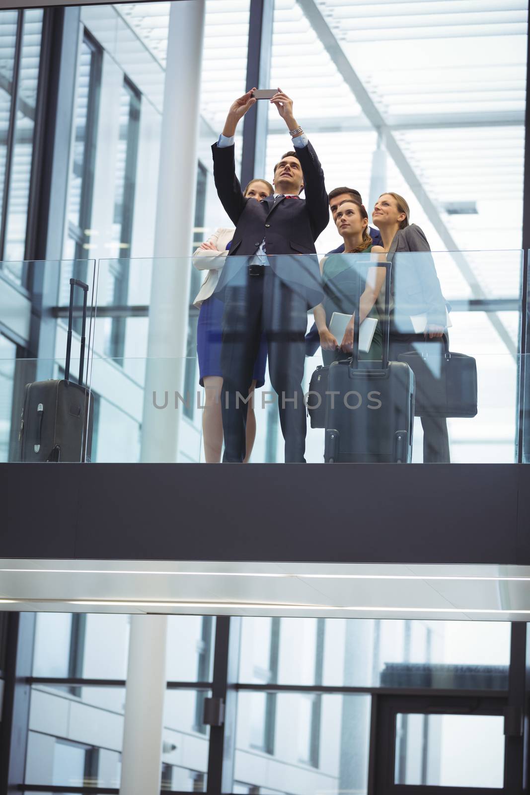 Business executives taking a selfie at office