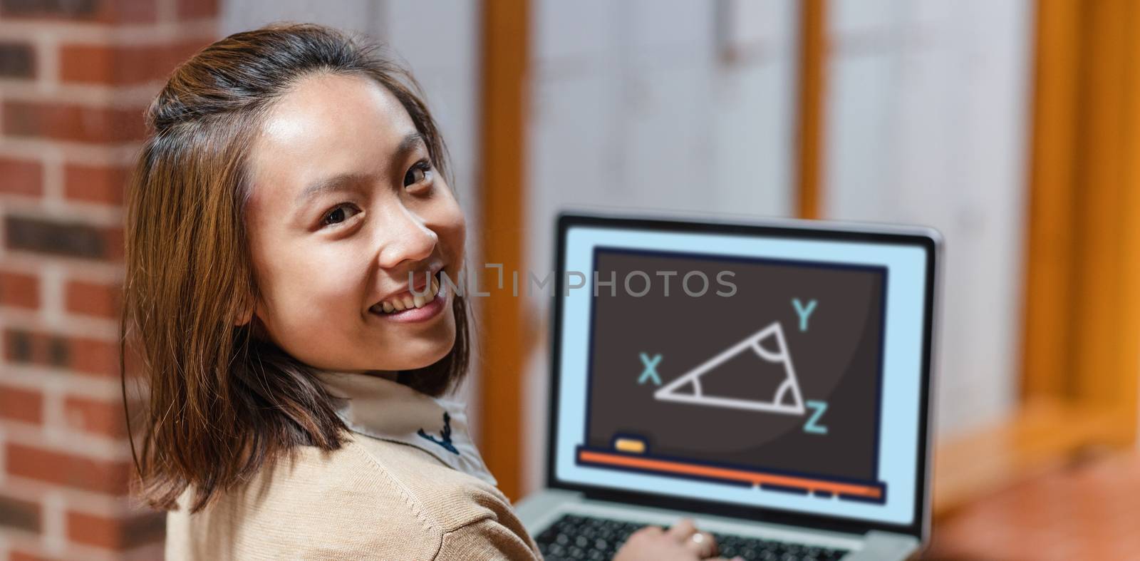 Print against happy young woman using laptop at college