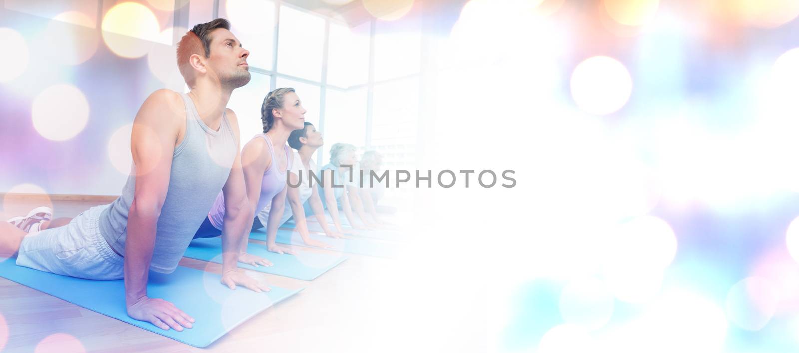 Glowing background against people exercising in row