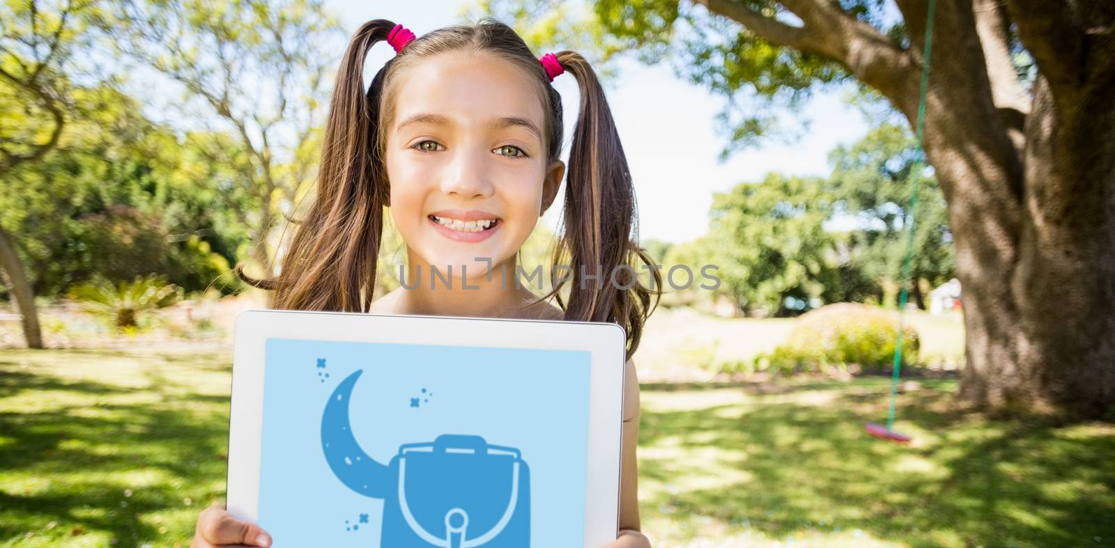 Print against portrait of young girl holding digital tablet