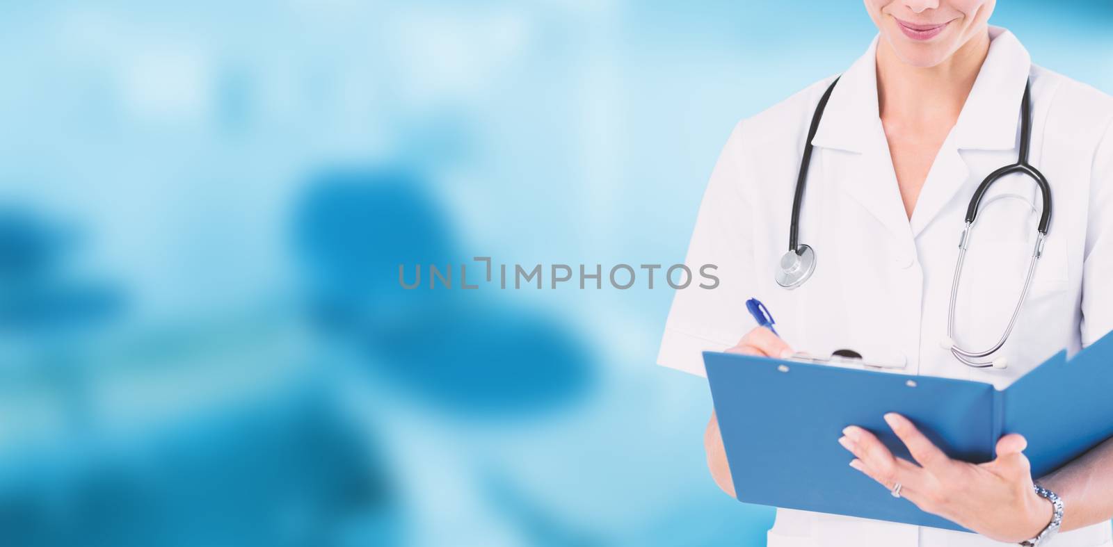 Doctor writing on clipboard behind bed against dental equipment