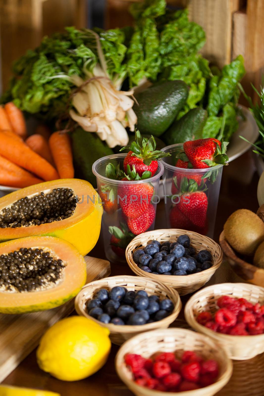 Various fruits and vegetables in wicker basket at health grocery shop
