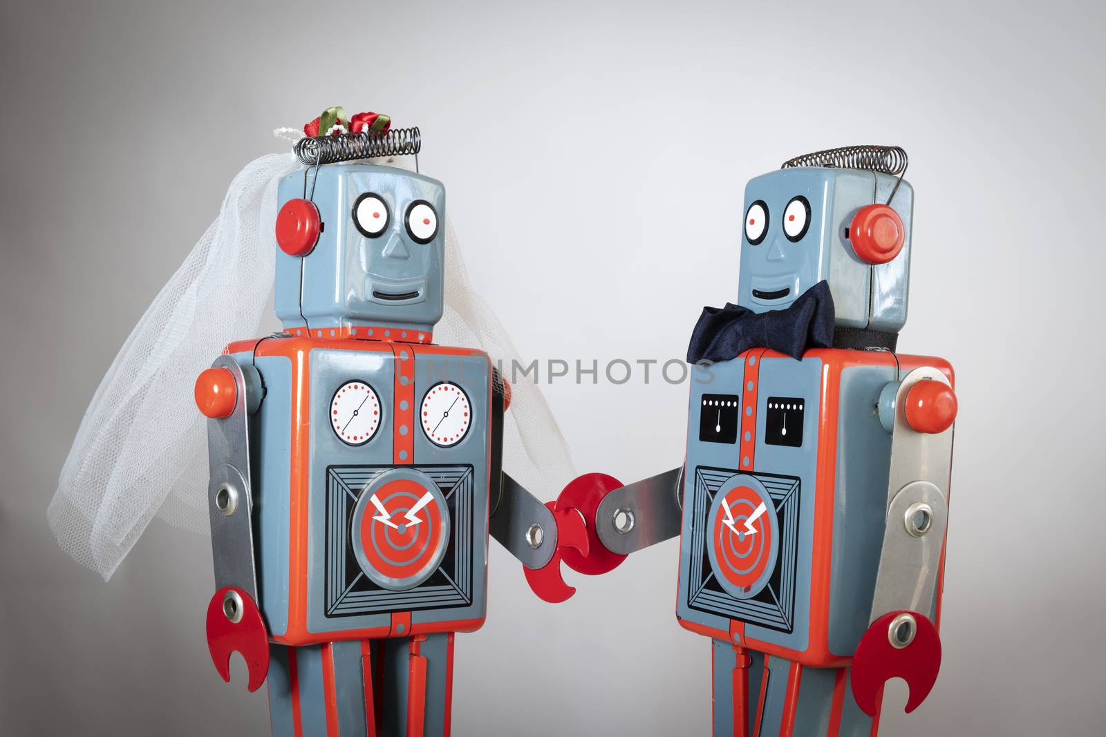 Two heterosexual robots getting married themes of humour love concept