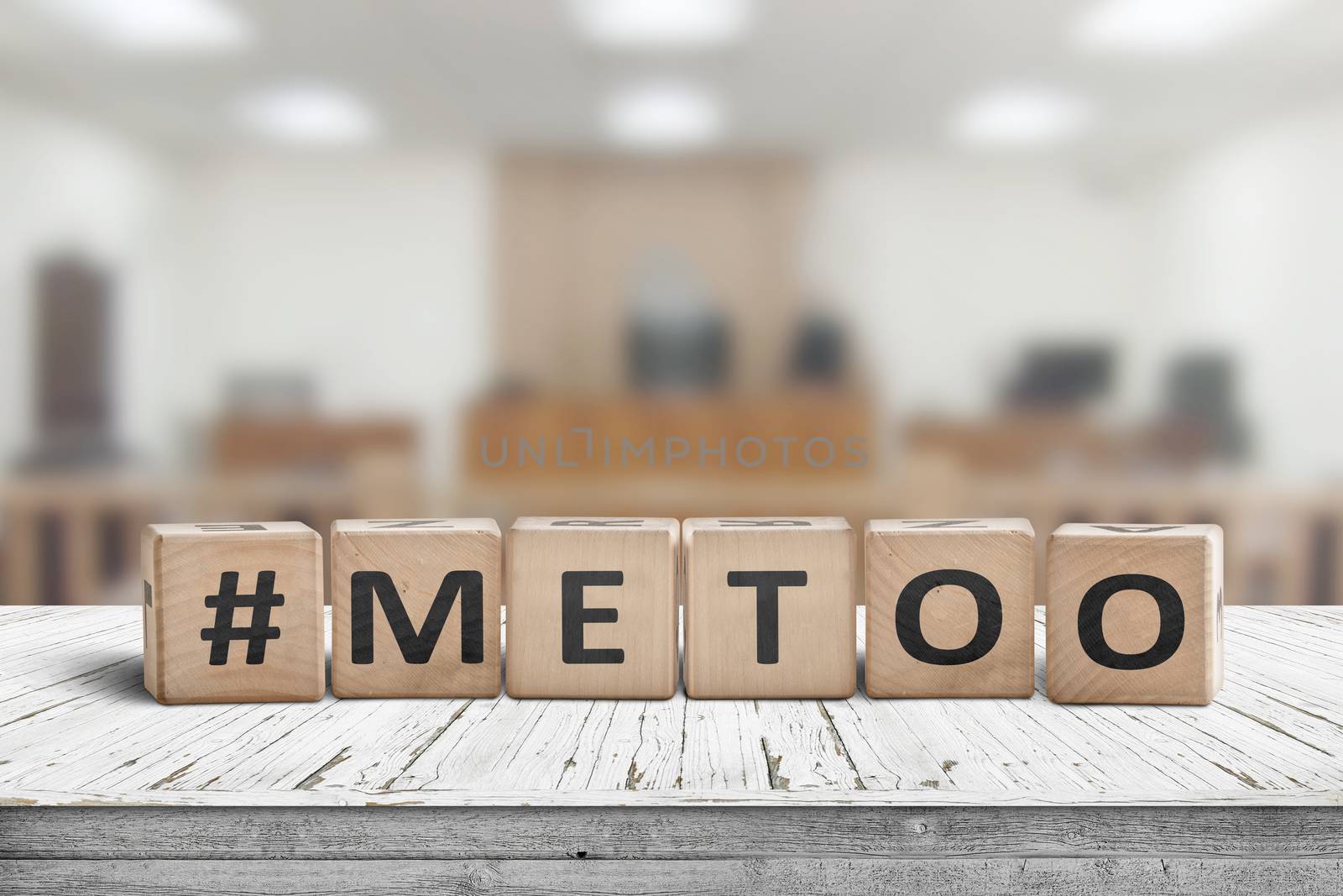 Metoo hashtag sign made of cubes on a wooden table in a courtroom