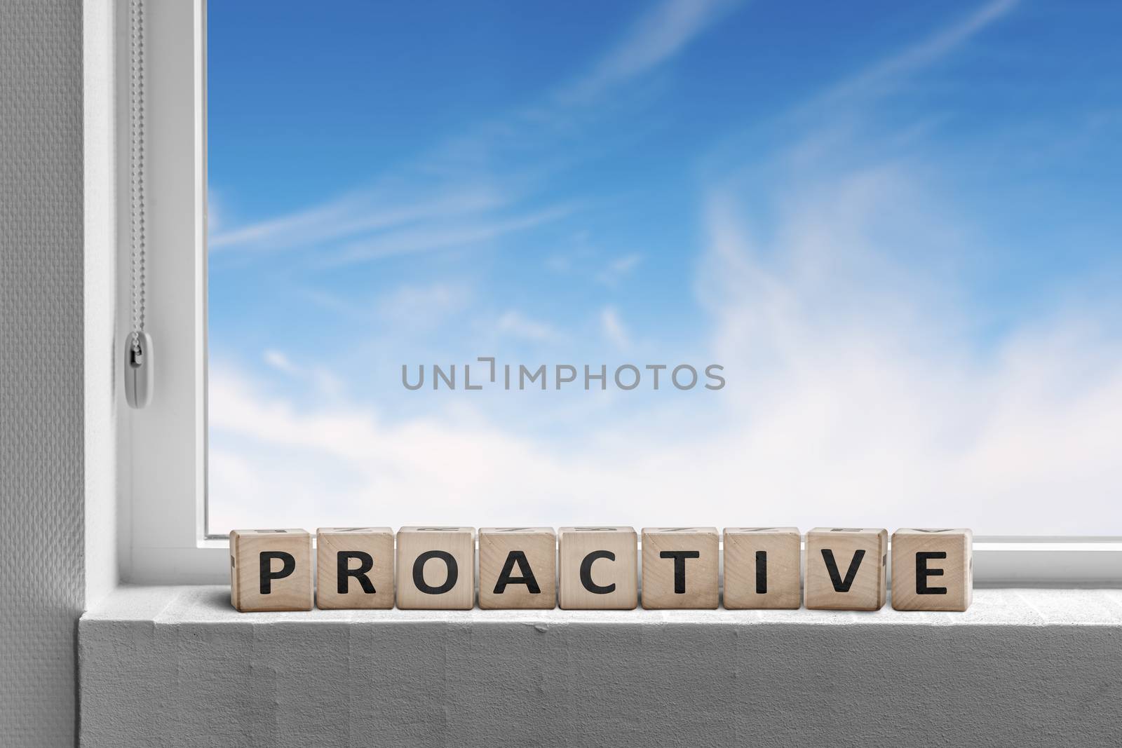 Proactive sign in a window sill on a bright day with a blue sky outside