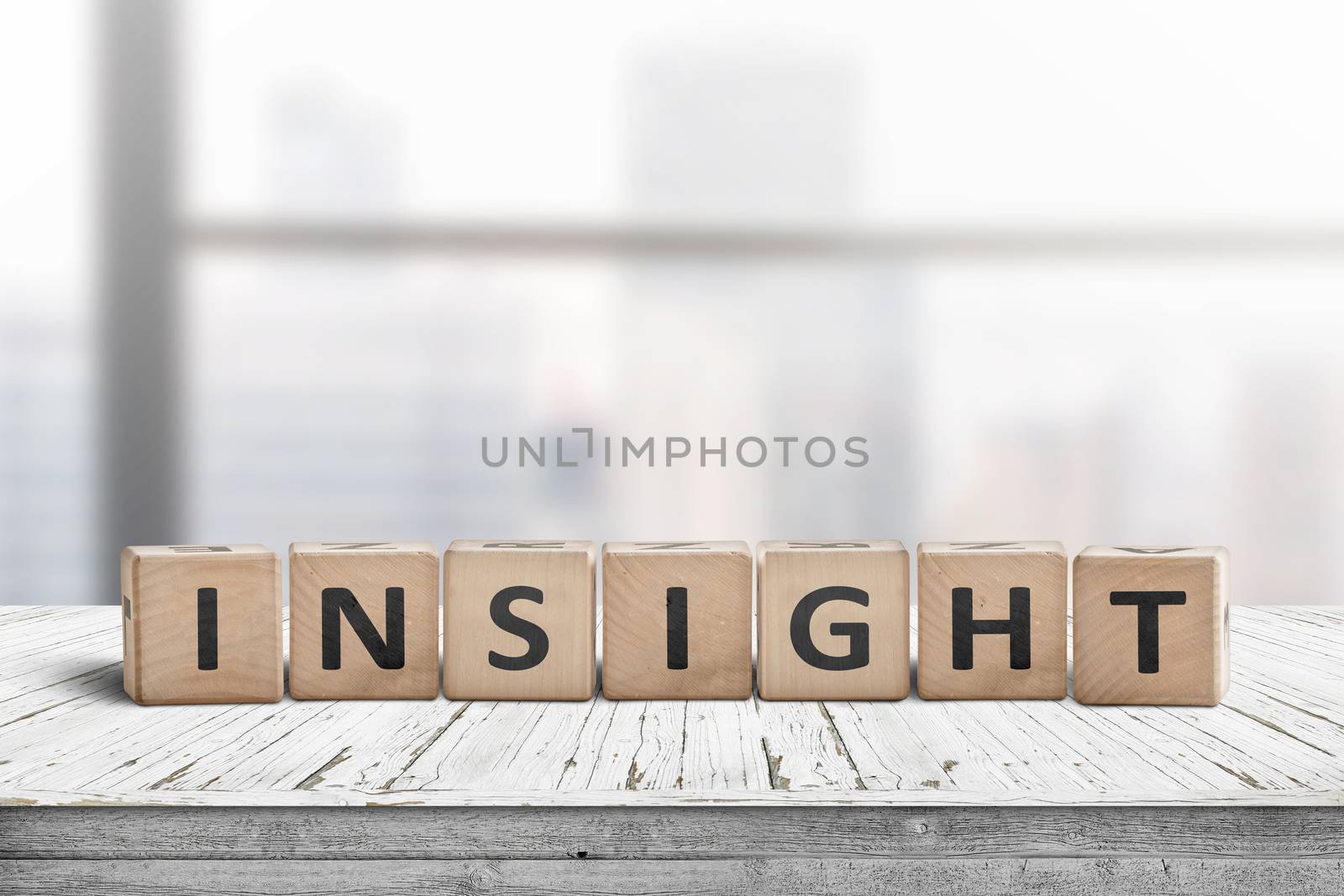 Sign with the word insight in a bright office environment on a white table