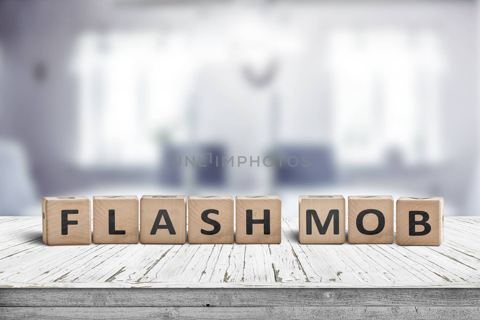 Flash mob message sign on a table in a bright room with light