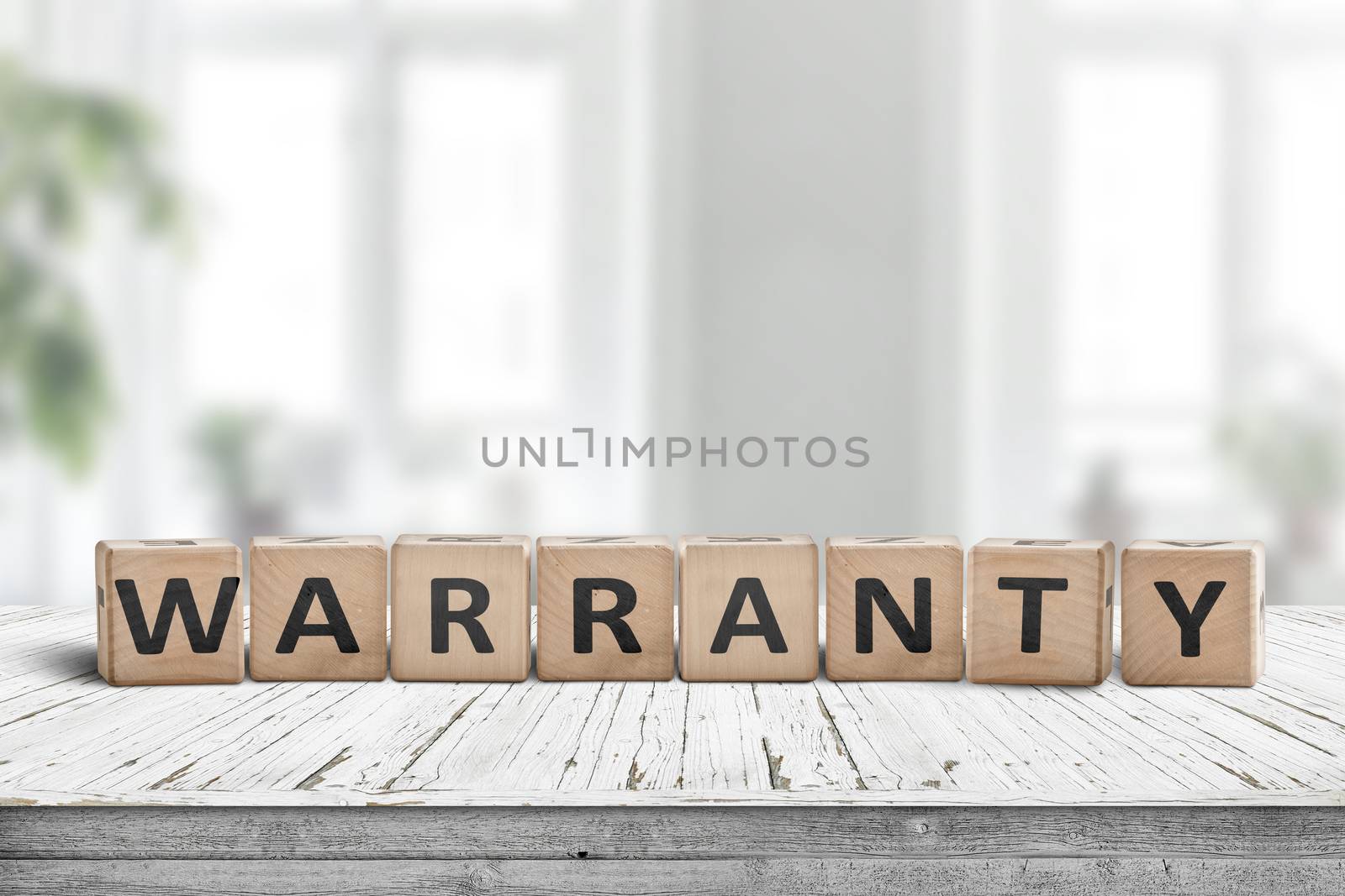 Warranty sign on a wooden desk in a bright environment with green plants