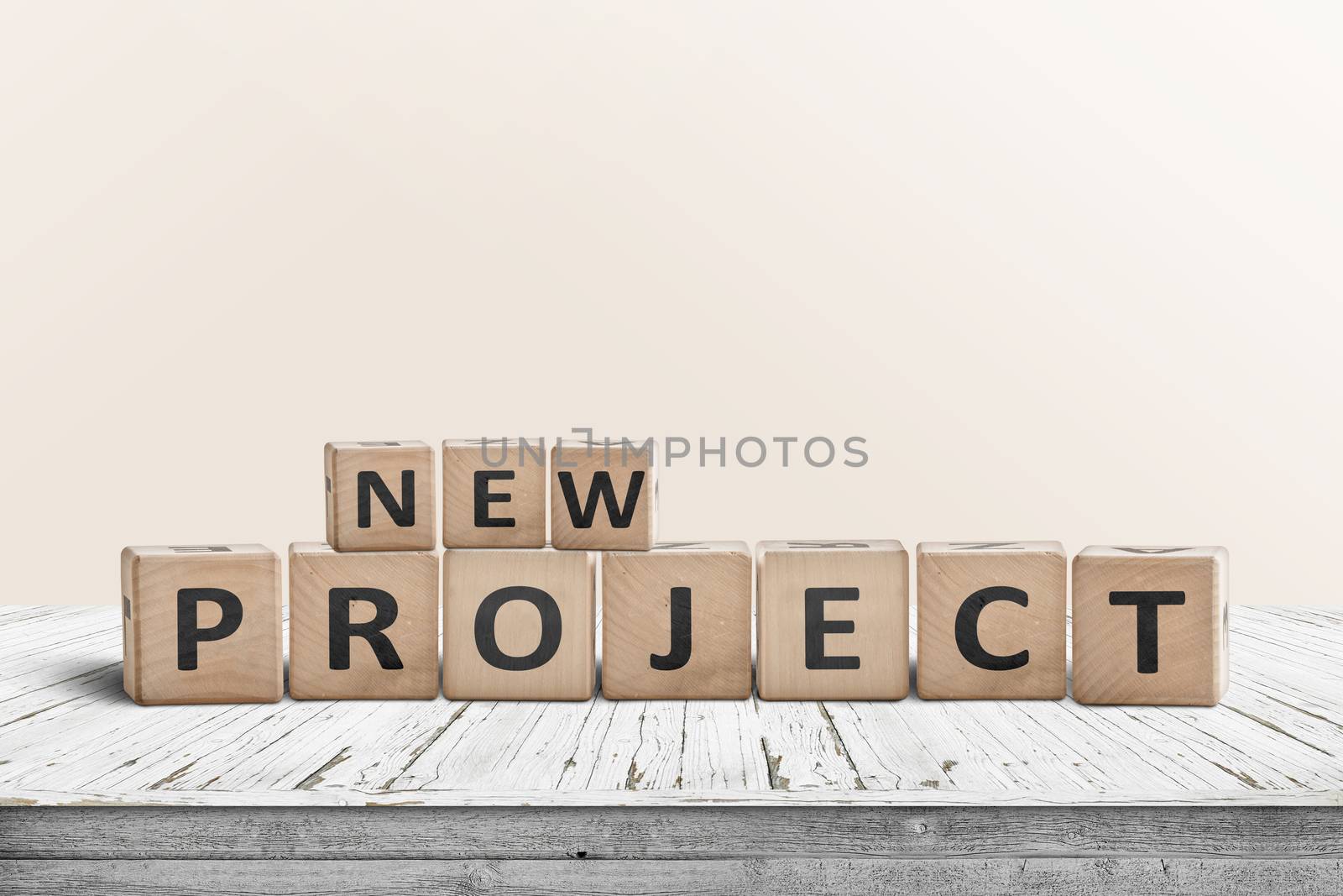 New project message on a wooden table in a bright room