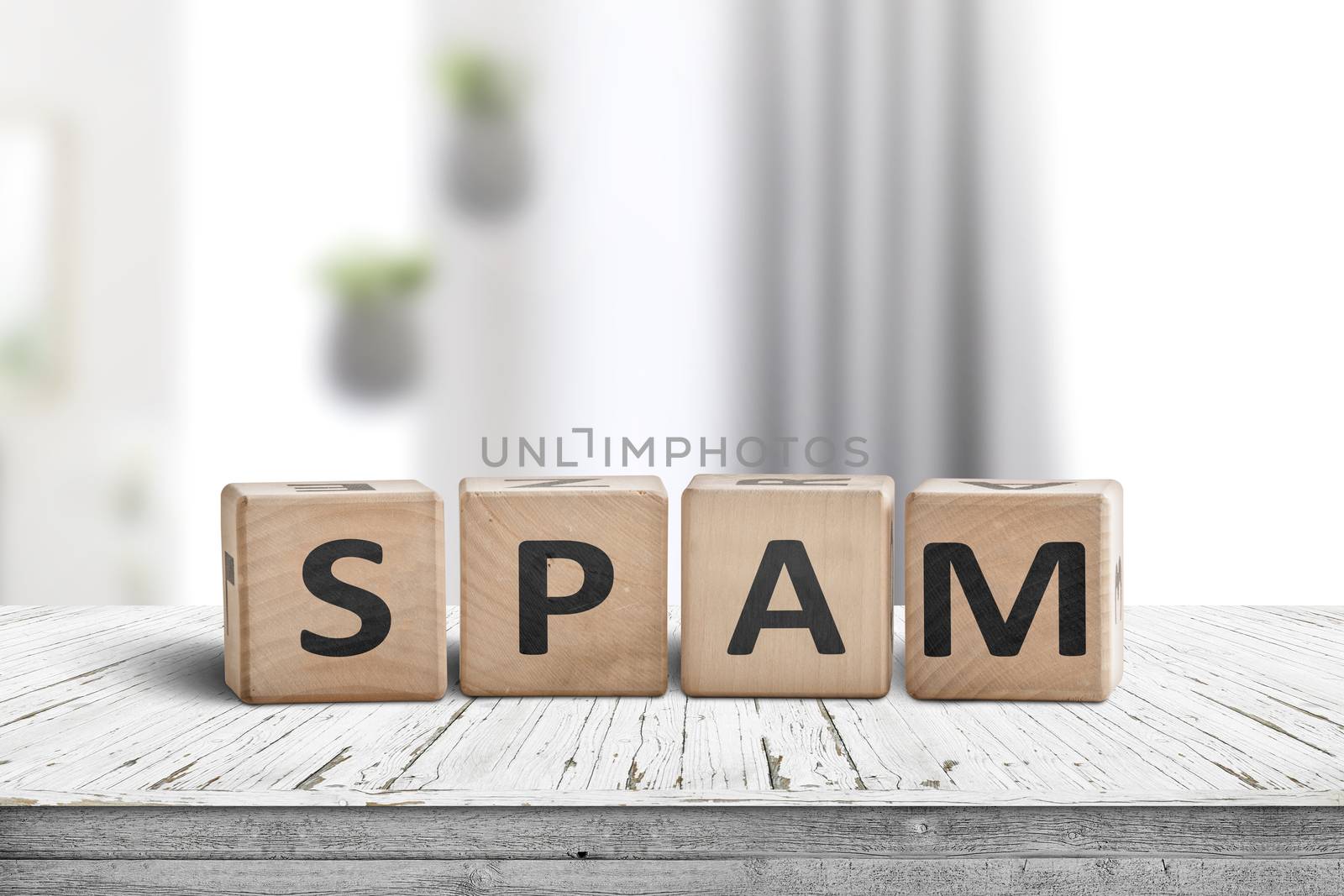 Spam sign on a white desk with wooden blocks in a bright room