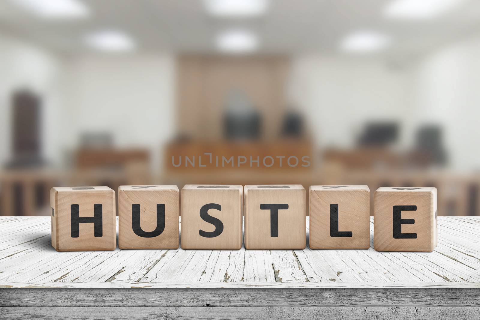 Hustle sign with text on a worn desk in a courtroom with bright lights