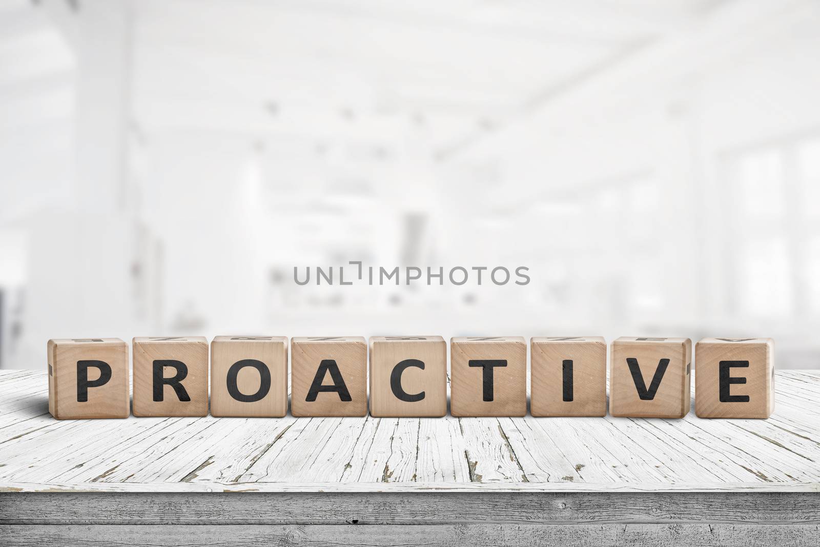 Proactive sign on a wooden table in a bright office in daylight