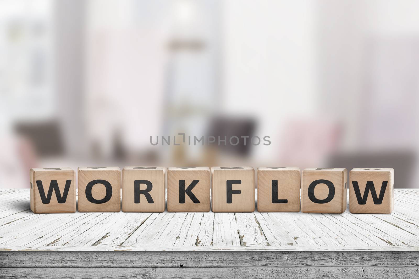 Workflow sign in a bright office on a wooden desk by Sportactive