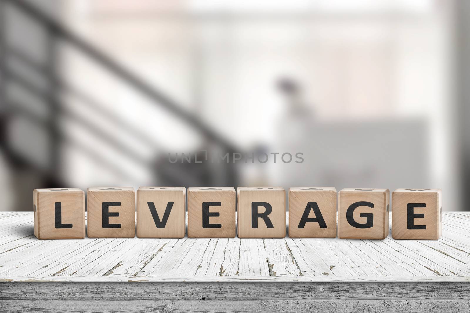 Leverage sign in a office environment on a wooden desk