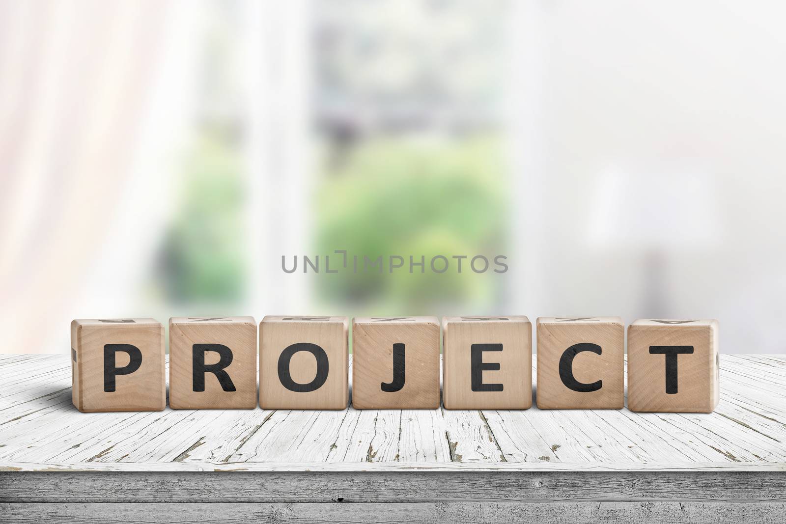 Wooden project sign in a bright room on a table with blocks