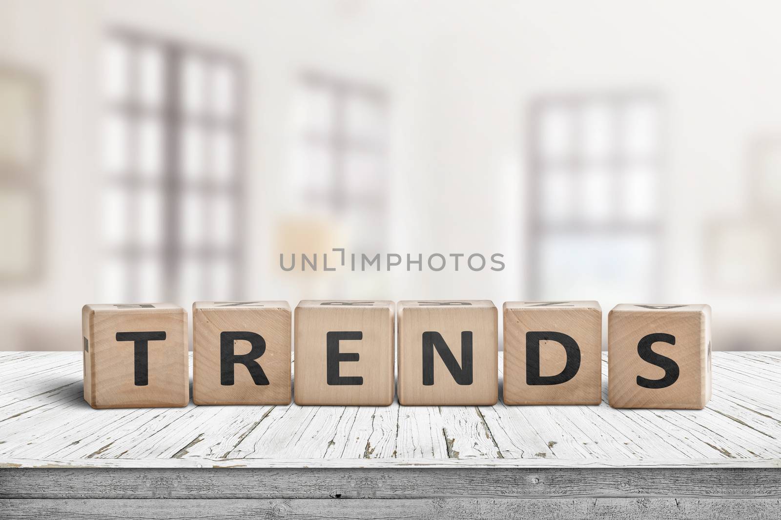 Trends sign in a bright home on a wooden desk with white paint