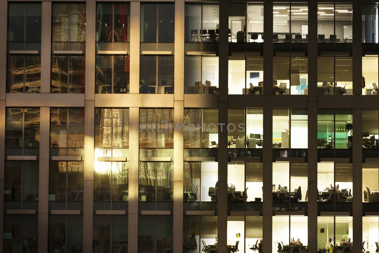 A composite image of an office scene fading from day to night time.