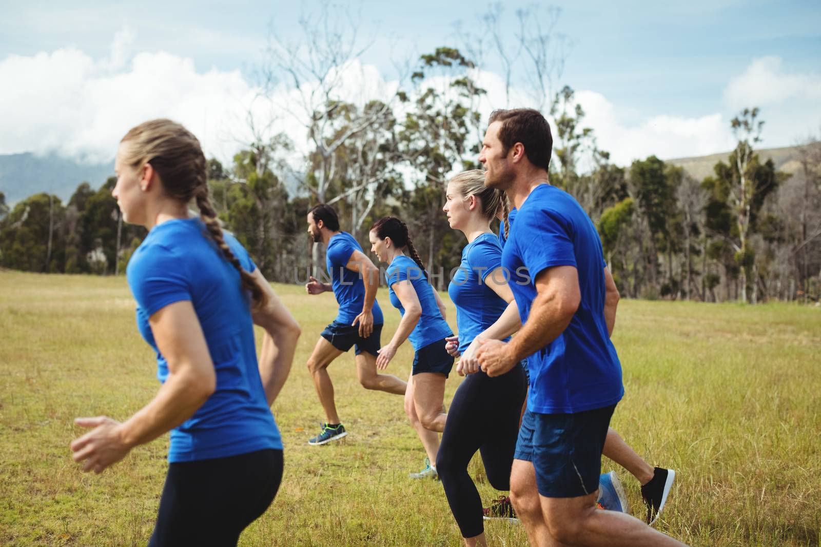 Fit people running in boot camp