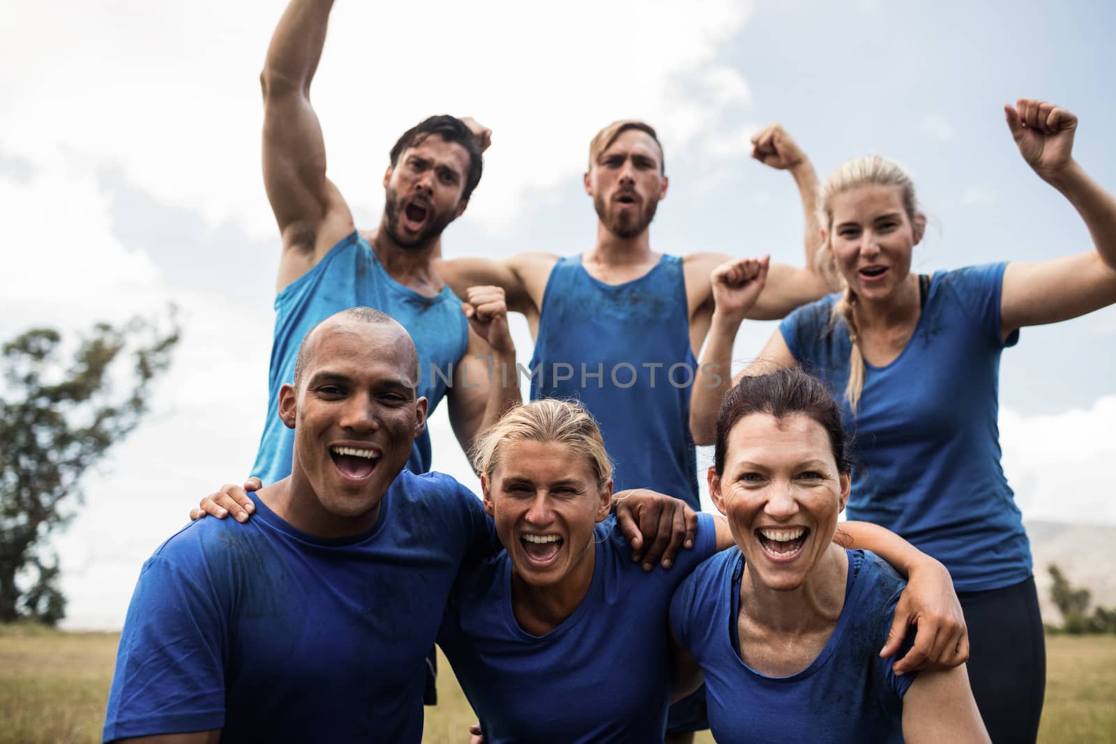 Fit people cheering together by Wavebreakmedia