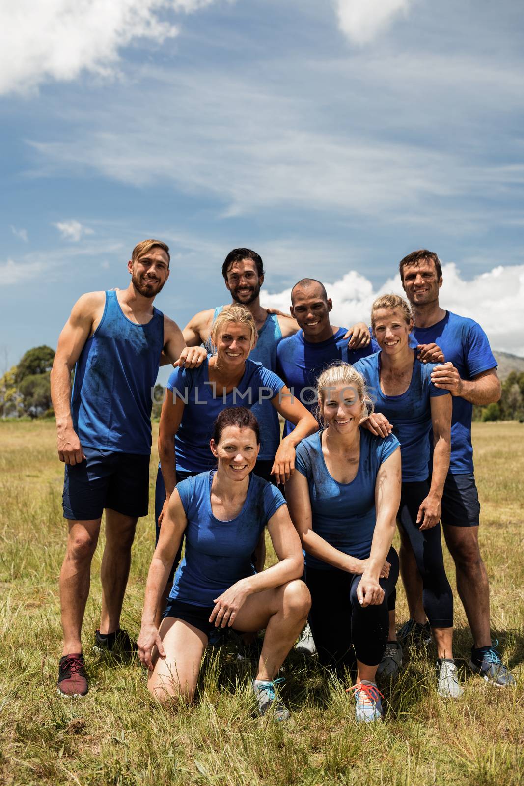 Group of fit people posing together in boot camp by Wavebreakmedia