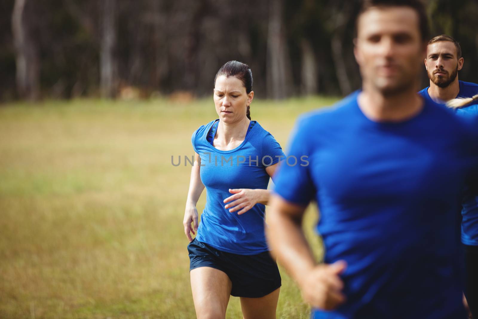 Fit people running in boot camp