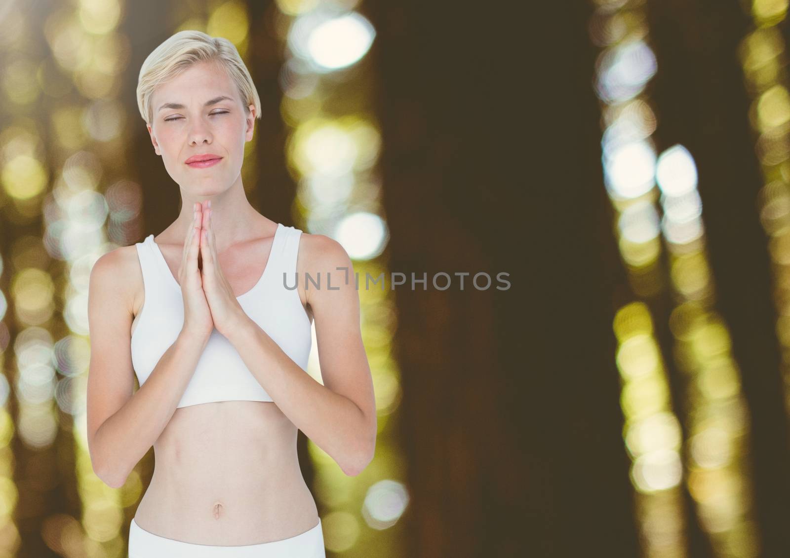 Woman Meditating Yoga Peaceful praying in woods by Wavebreakmedia