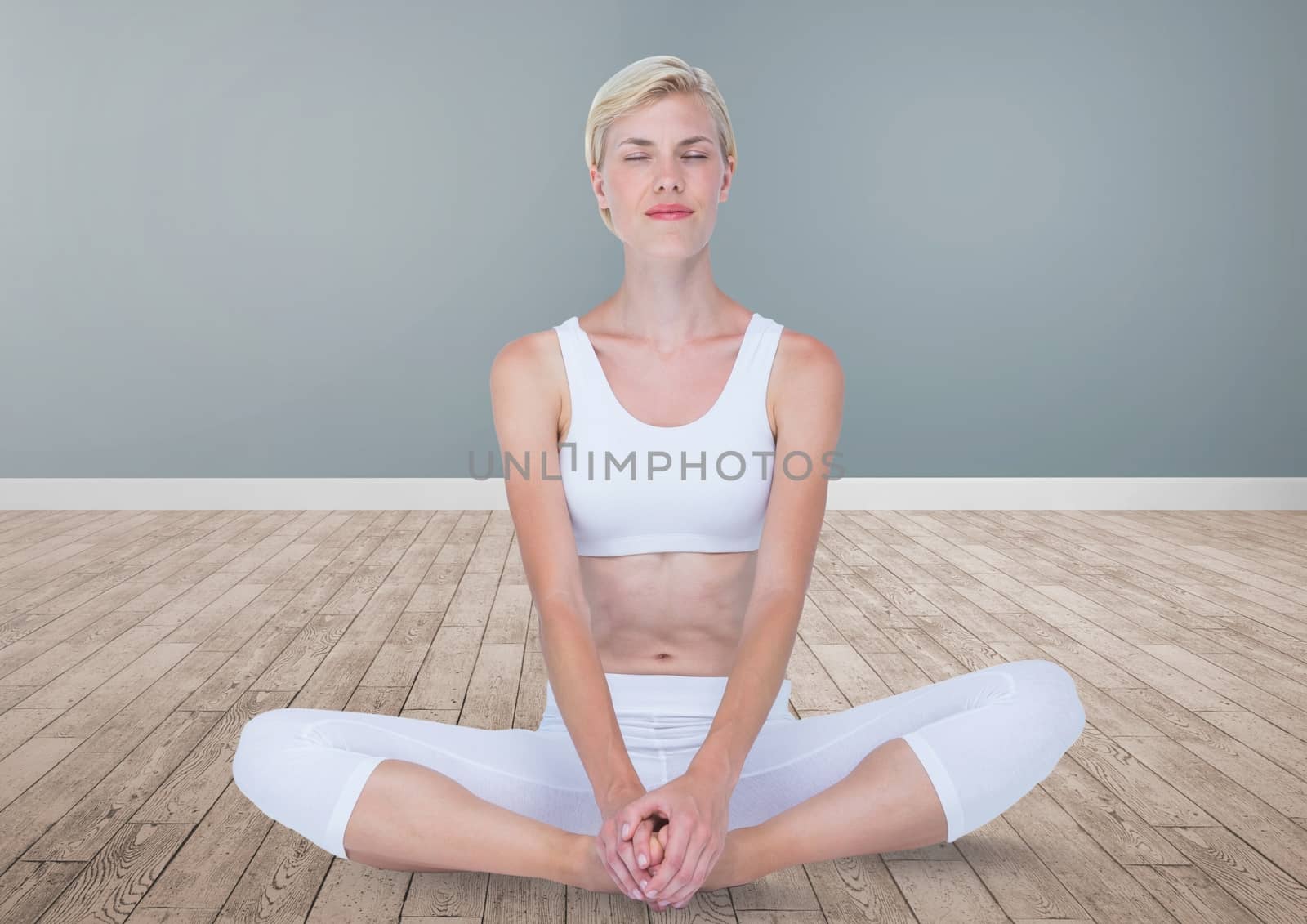 Digital composite of Woman Meditating peaceful yoga in room