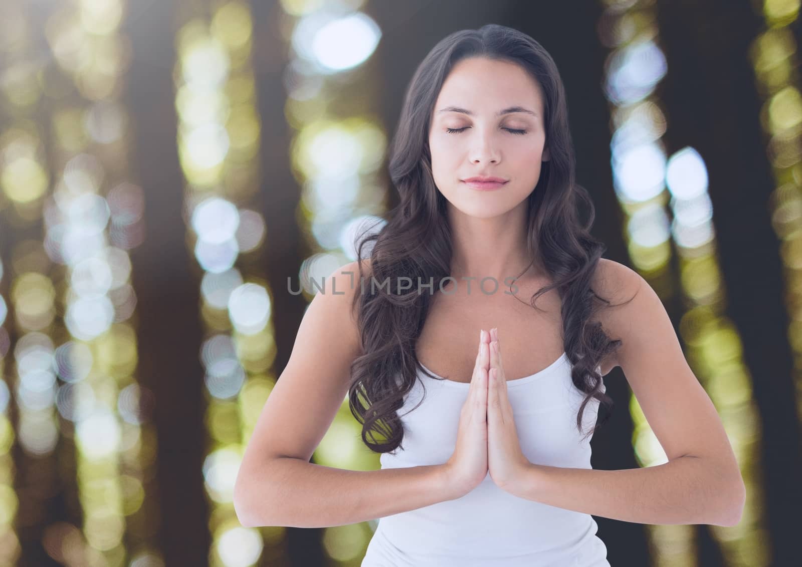 Digital composite of Woman Praying Meditating yoga peaceful in forest