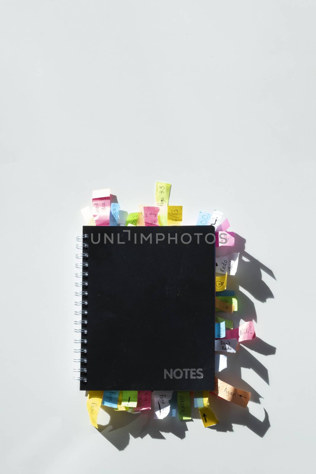 Top view of a note pad full of sticky notes