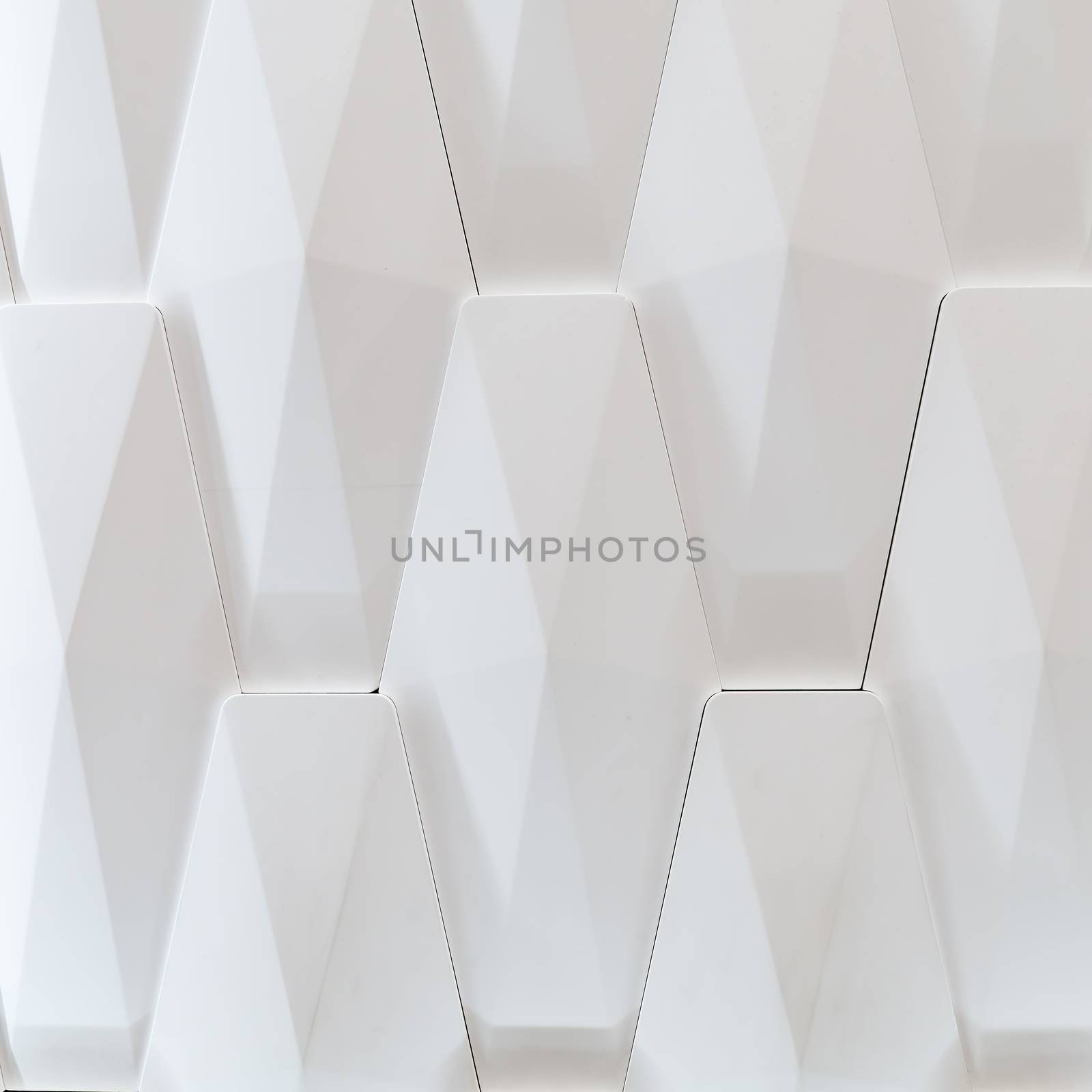 3D decorative wall for the interior of an unusual geometric shape. White light background with a pattern imitating a tree. Abstract texture