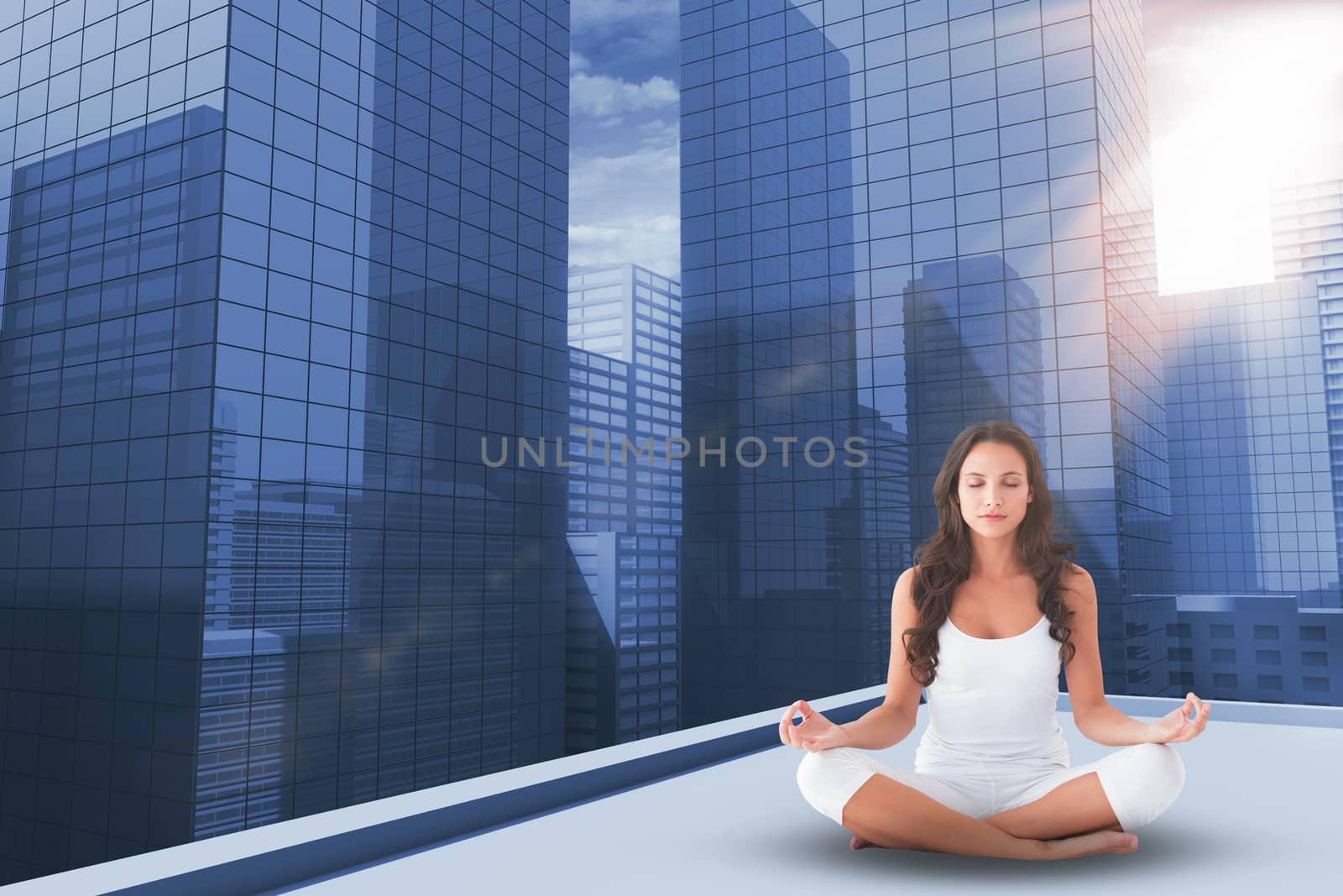 Composite image of pretty brunette doing yoga by Wavebreakmedia