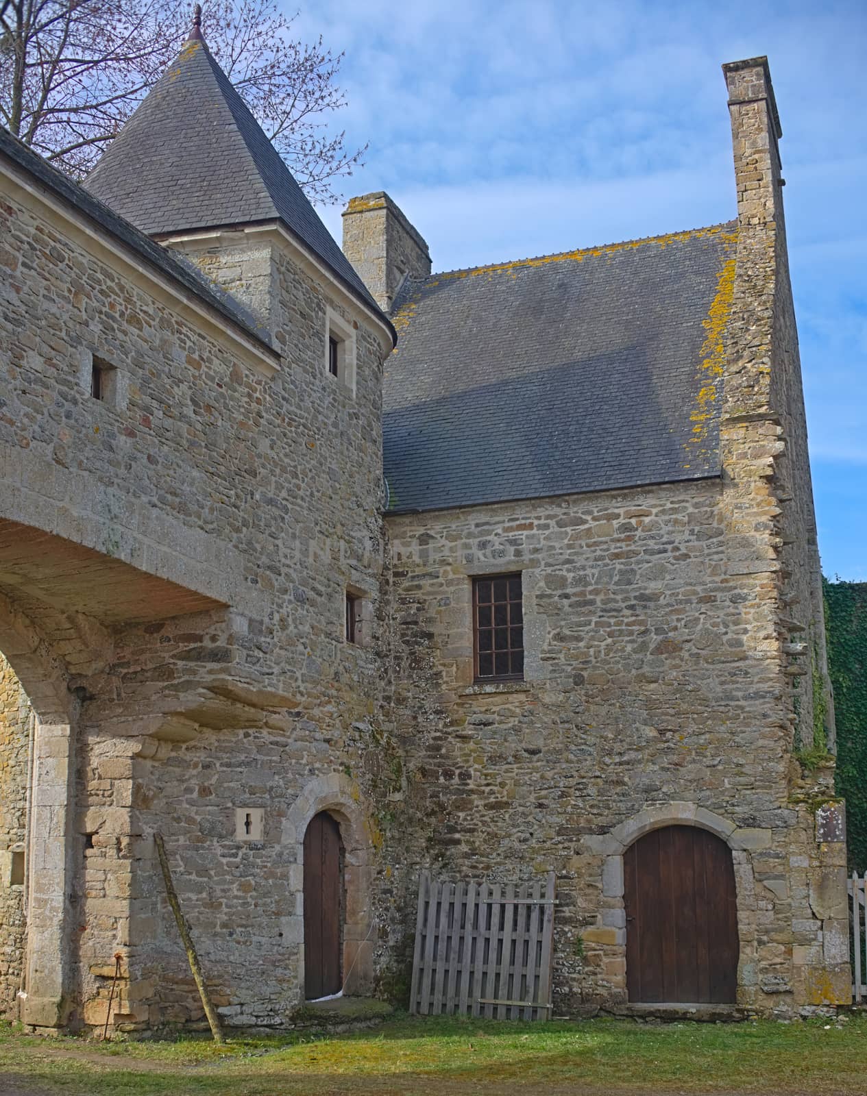 Gate and entrance building into castle Monfert, France