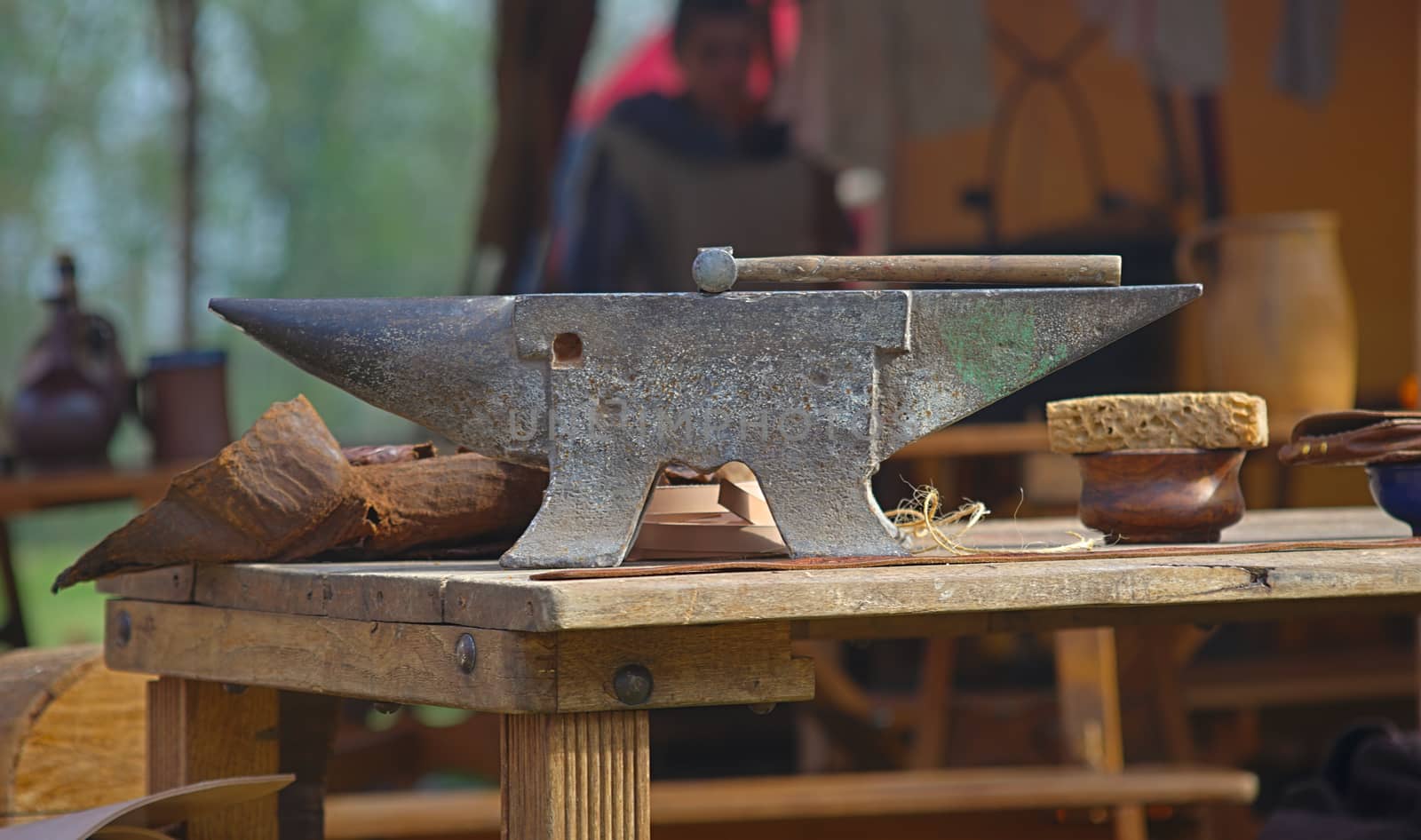 Anvil on a wooden desk representing medieval blacksmith