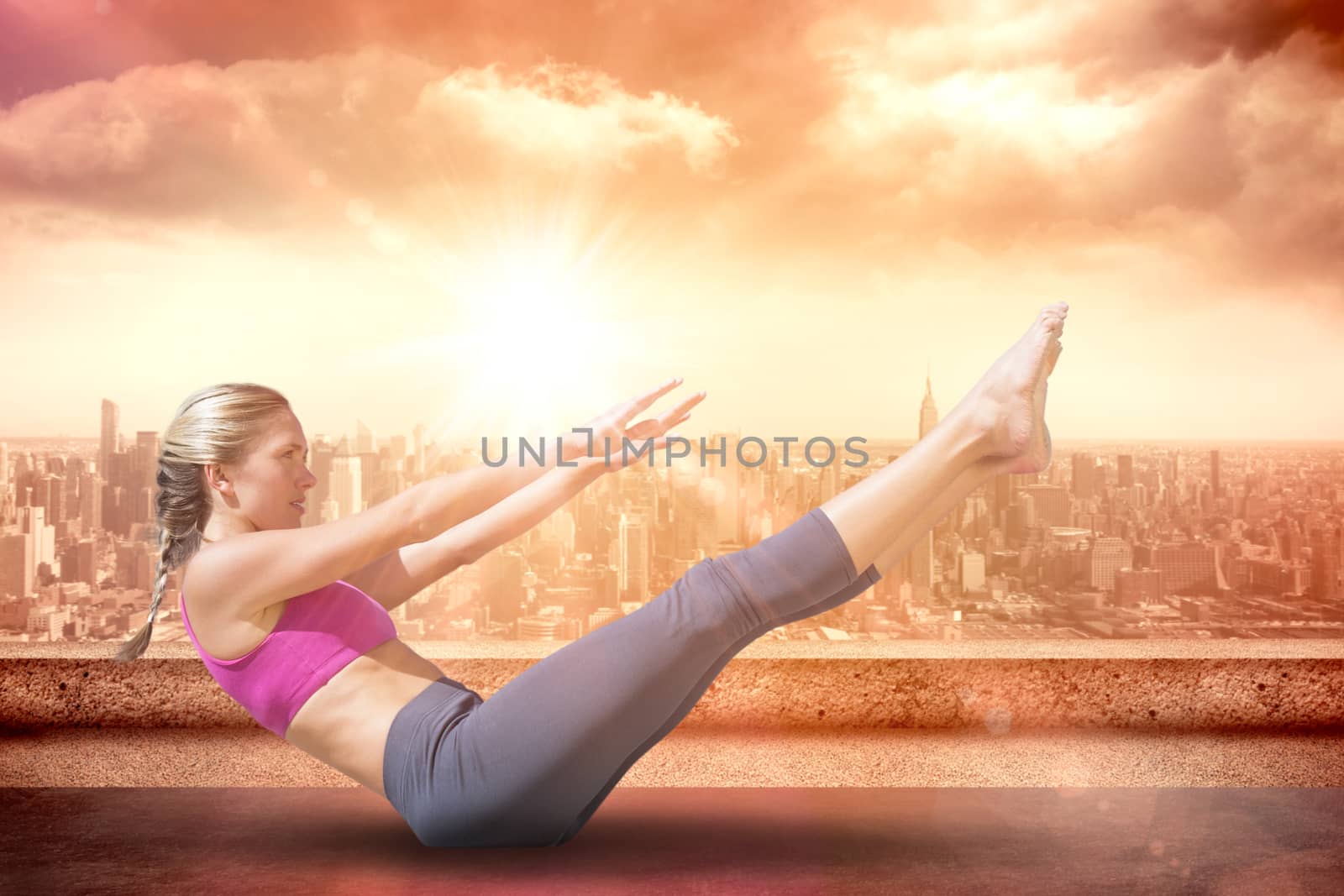 Composite image of focused fit blonde doing yoga on the beach by Wavebreakmedia