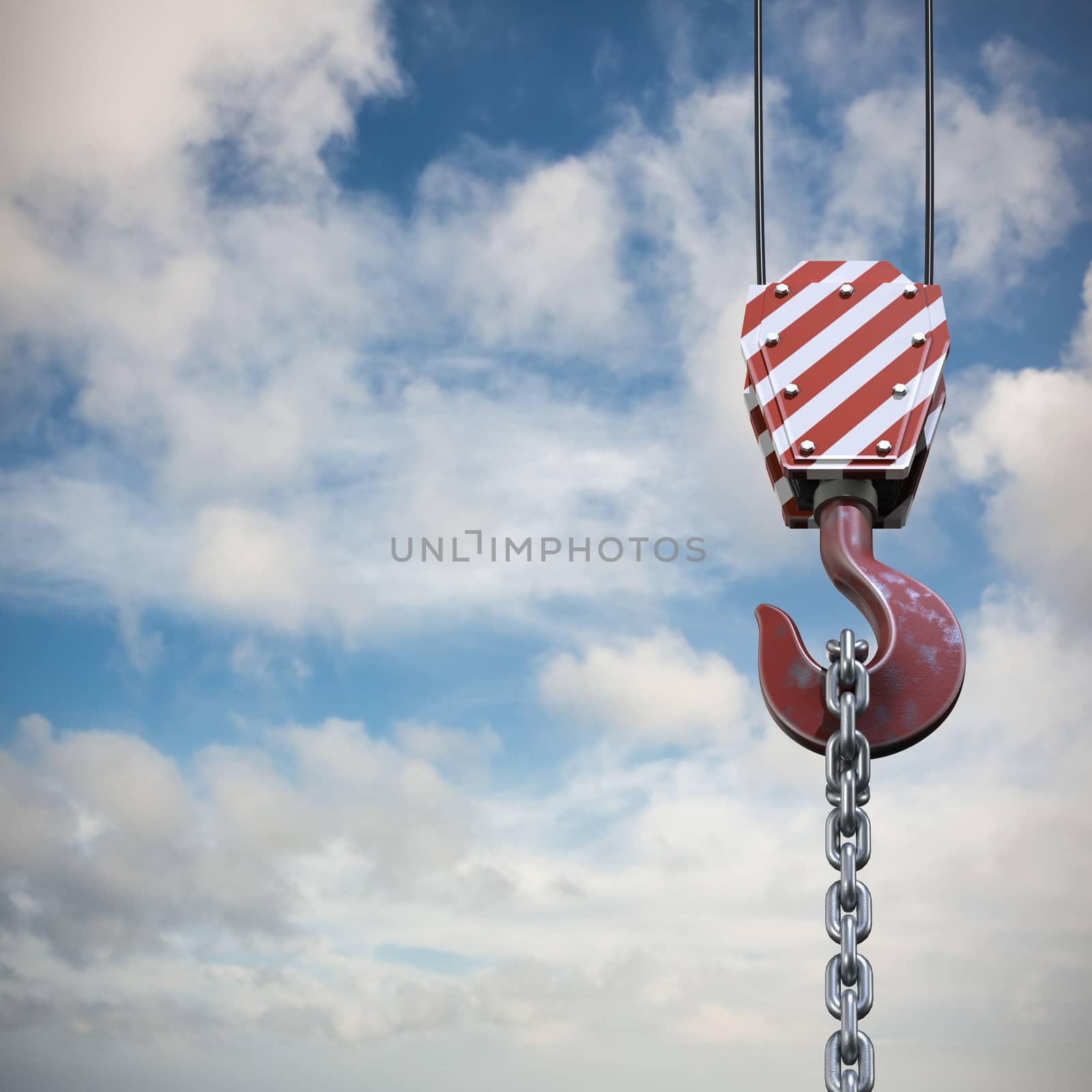 Studio Shoot of a crane lifting hook against blue sky with white clouds