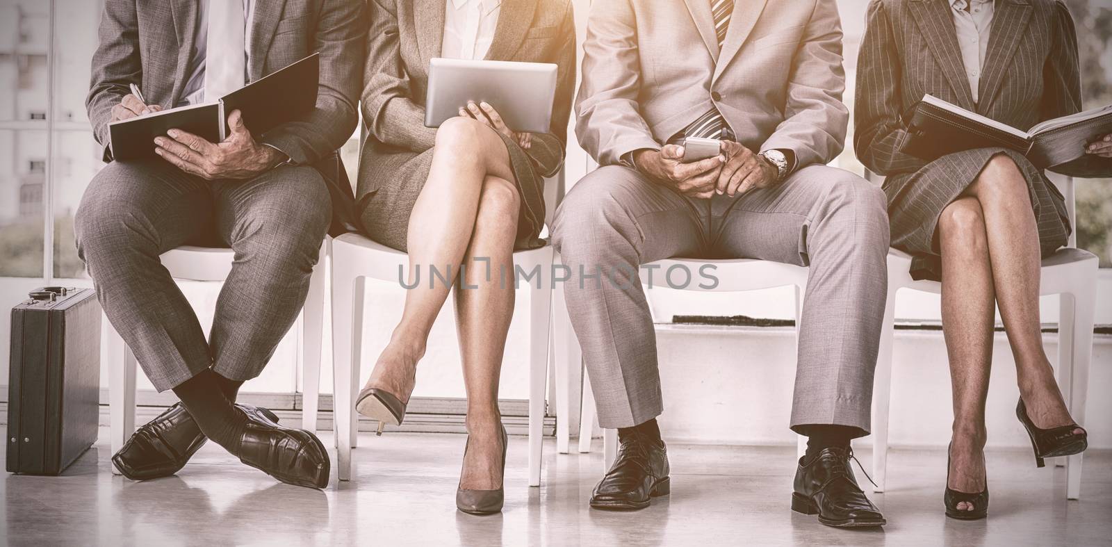 Business people waiting to be called into interview by Wavebreakmedia