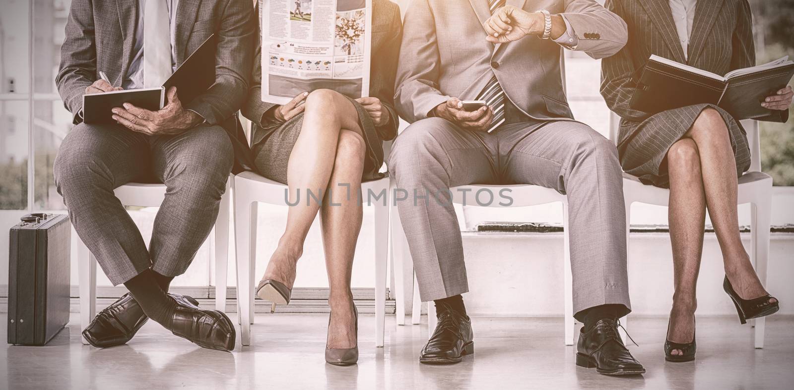 Business people waiting to be called into interview by Wavebreakmedia