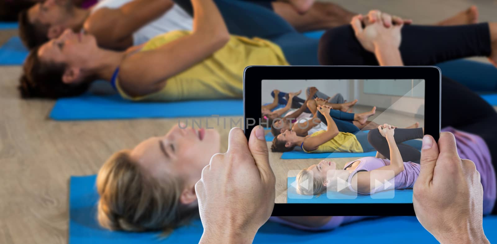 Composite image of cropped hand holding digital tablet by Wavebreakmedia