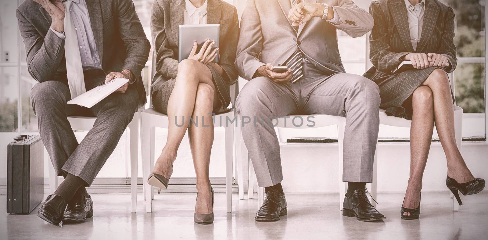 Business people waiting to be called into interview by Wavebreakmedia