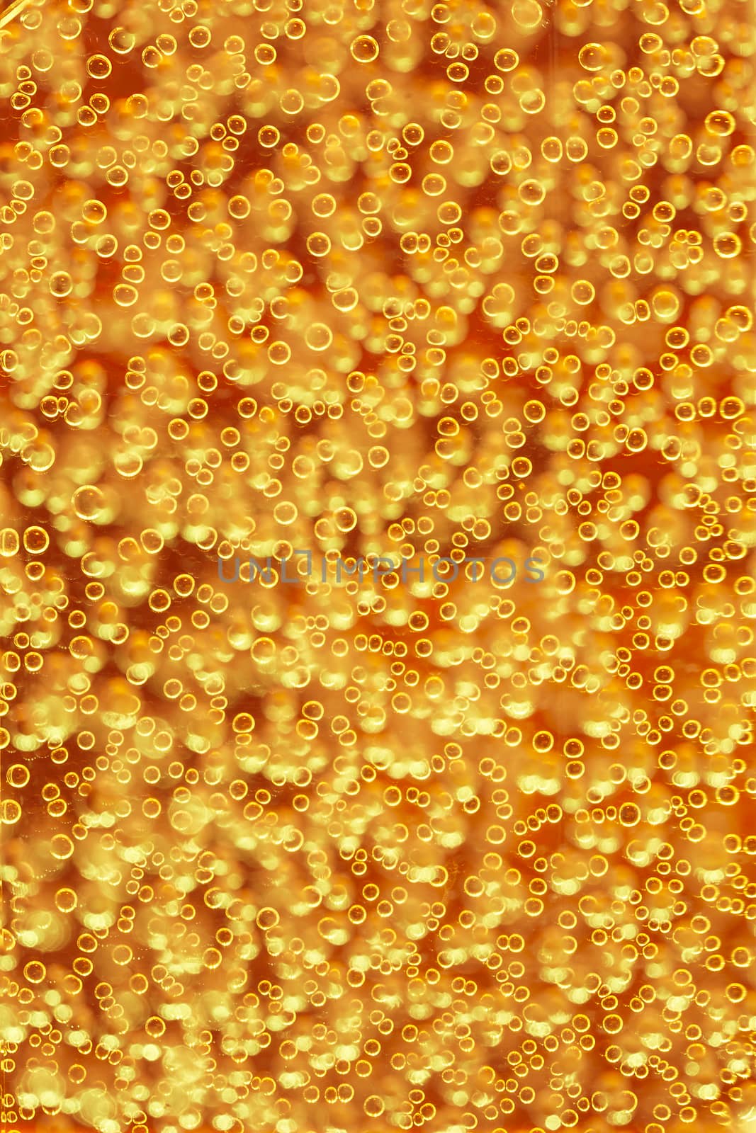 Highly detailed texture of gaseous liquid with sparkling yellow bubbles