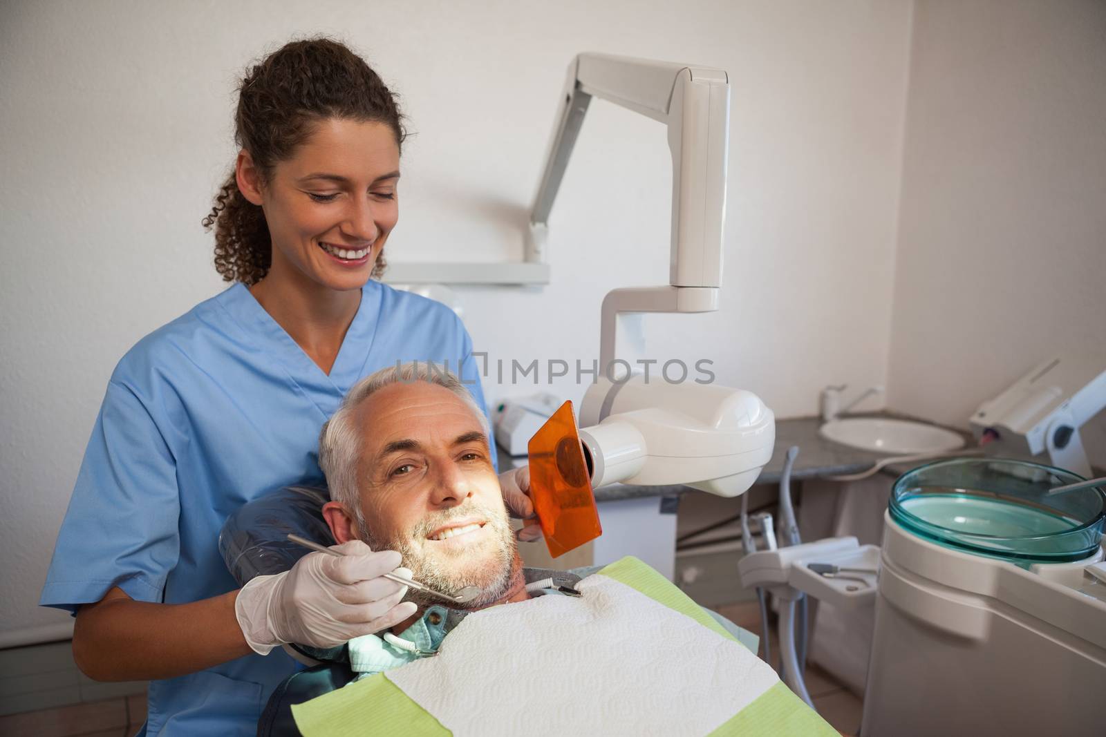 Dentist taking an xray of patients mouth at the dental clinic