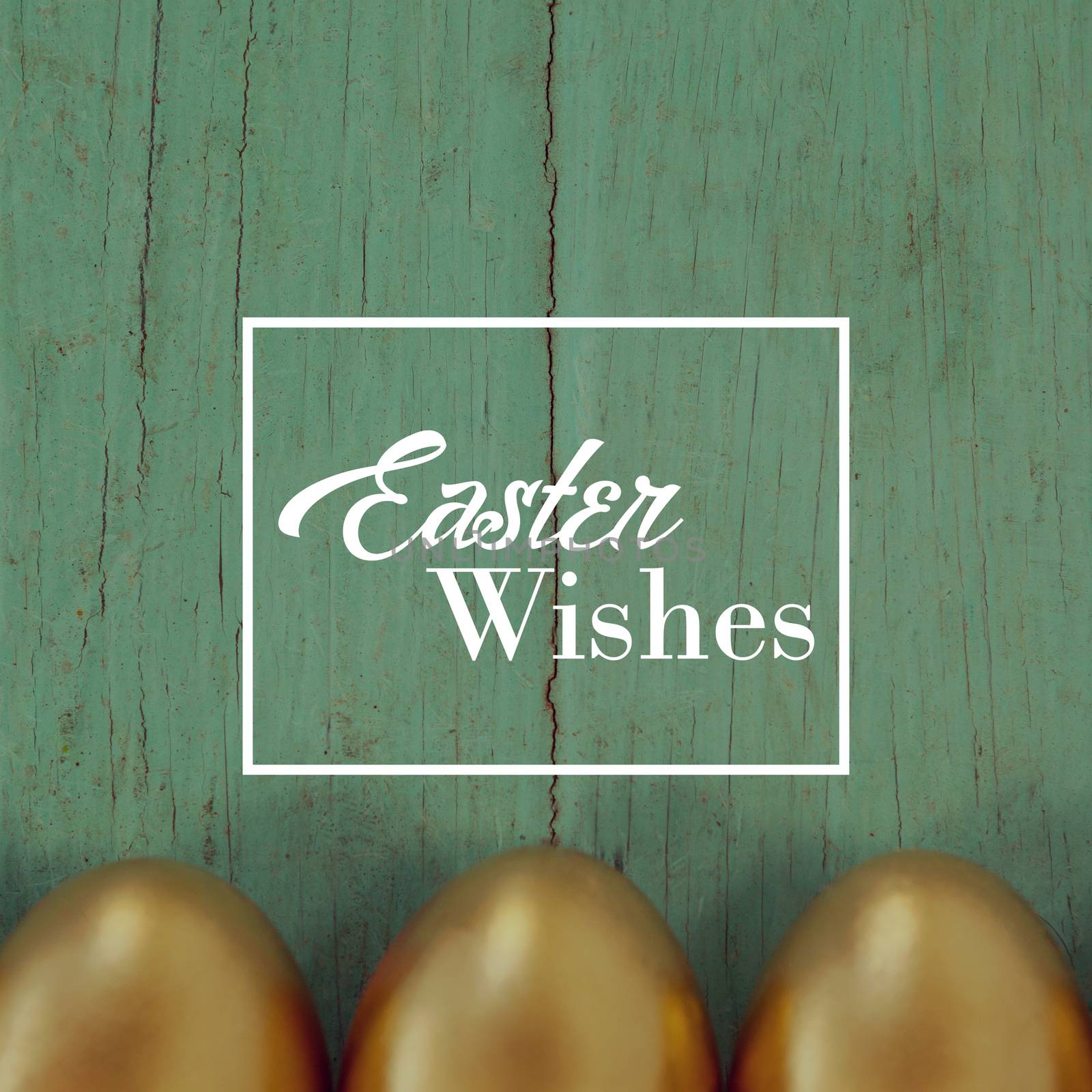 Easter greeting against golden easter eggs arranged on wooden surface