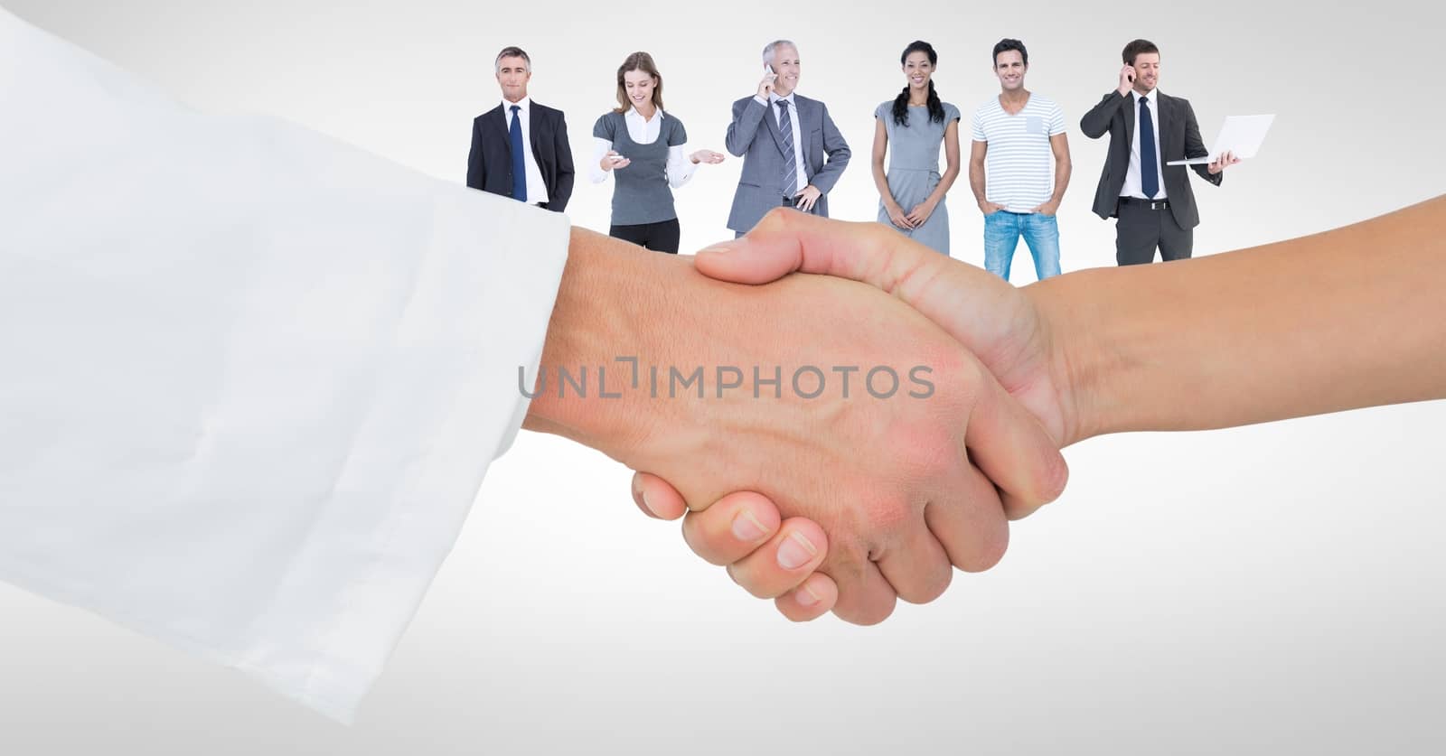 Digital composite of Close-up of handshake with people in background