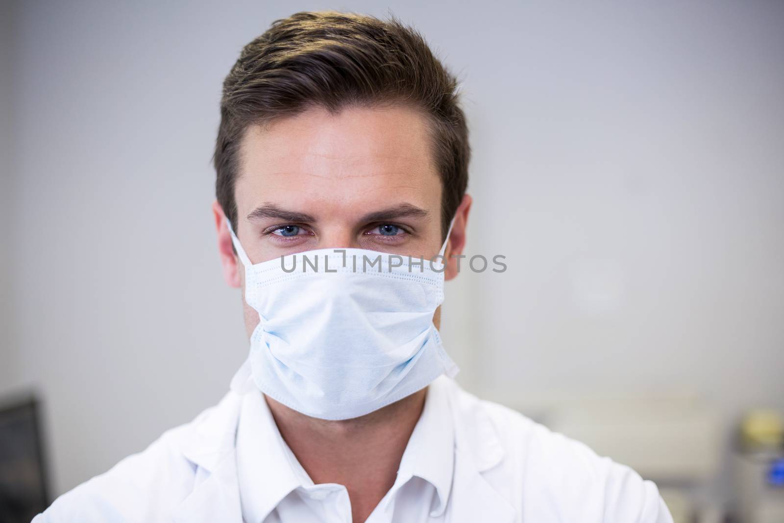 Portrait of dentist wearing surgical mask in clinic